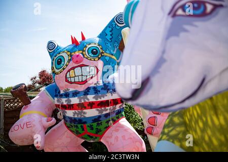 Disabled artist Jason Wilsher-Mills, who had been due to show his work at the Tate after winning the equivalent of the Turner Prize for disabled artists, has found new ways to work while self-isolating during the coronavirus pandemic by putting his giant inflatable sculptures on display in the back garden of his home in Sleaford, Lincolnshire. Stock Photo