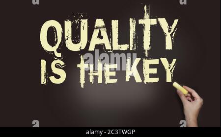 Quality Is The Key text on blackboard written with chalk. Business marketing and promotion concept Stock Photo