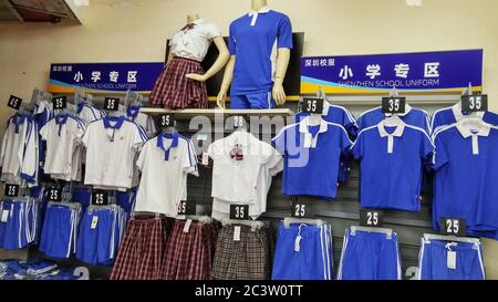 School uniforms for primary and middle school students are on sale in walmart. In Shenzhen, China. Stock Photo