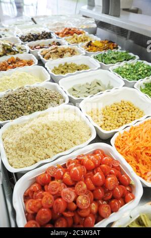 Cut and ready salad ingredients at a salad bar Stock Photo