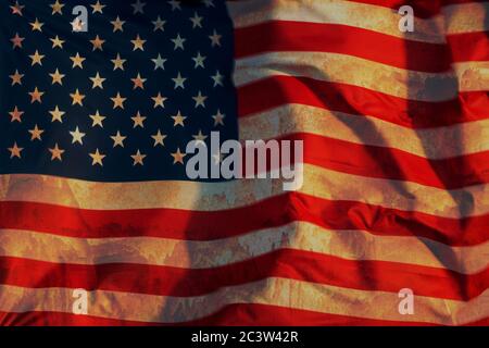 The USA flag covered with rust, symbolizing the so-called rust belt in which industry ceased to function Stock Photo