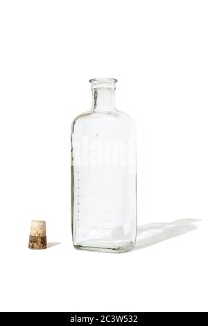 Old empty glass medicine bottle with the cork removed, on a white background Stock Photo