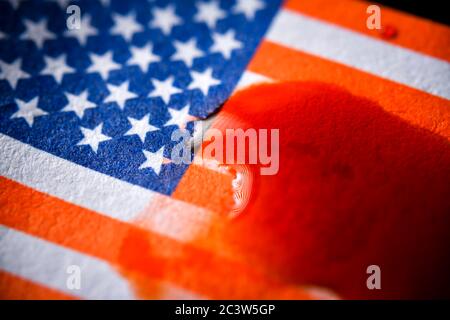 Blood on flag of the United States, violent riots after police violence in the US, Blut auf Fahne von der USA, gewaltsame Ausschreitungen nach Polizei Stock Photo