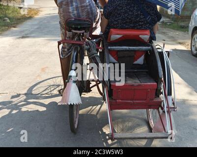 dh Thanlyin YANGON MYANMAR Back seat of local trishaw taxi Stock Photo