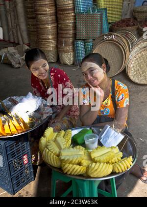dh Thanlyin Myo Ma Market seller YANGON MYANMAR Local Burmese girls thanaka bark makeup cream selling fruit people girl woman street food women asia Stock Photo