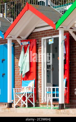 Brightly coloured beach hut on the beach at Swanage, Dorset, England. Stock Photo