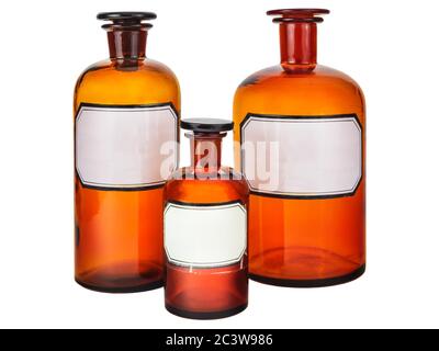 Three vintage pharmacy bottles with blank labels isolated on a white background Stock Photo