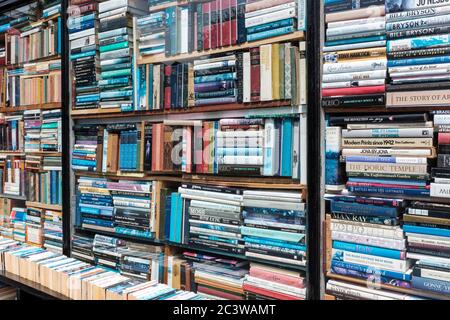 London,UK- Shelves stacked with books in antiquarian bookstore, Stock Photo