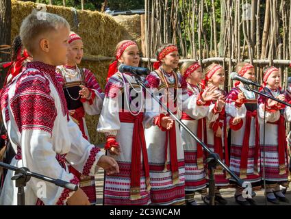 Voronezh, Russia - September 05, 2019: Children sing folk songs in national costumes.