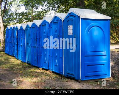 Voronezh, Russia - September 05, 2019: A row of blue dry closets in a city park