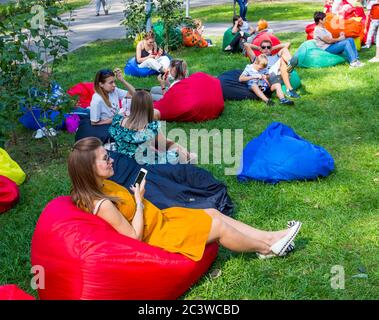 Voronezh, Russia - September 05, 2019: A place for people to relax on the lawn in the central park, the city of Voronezh