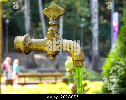 Voronezh, Russia - September 05, 2019: Water-hanging faucet hanging in the air as part of a park design