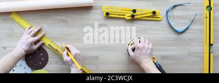 Handyman holding sander machine Stock Photo