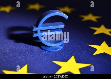 Euro sign on EU flag, EU Reconstruction Fund and EU aid, Eurozeichen auf EU-Fahne, EU-Wiederaufbaufonds und EU-Hilfen Stock Photo