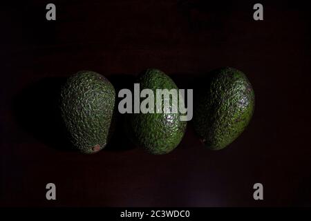 Close-up of fresh avocado on black background Stock Photo