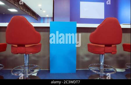 Two red bar stools in a blue interior  Stock Photo
