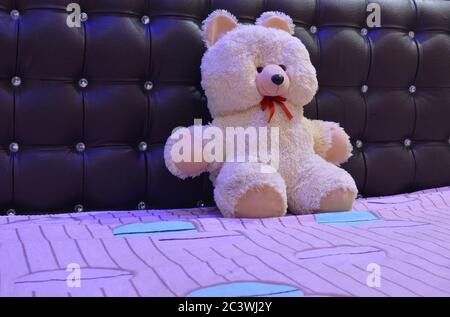 Cute teddy bear in the bed Stock Photo