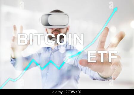 Bitcoin ETF, Exchange traded fund and cryptocurrencies concept on virtual screen Stock Photo