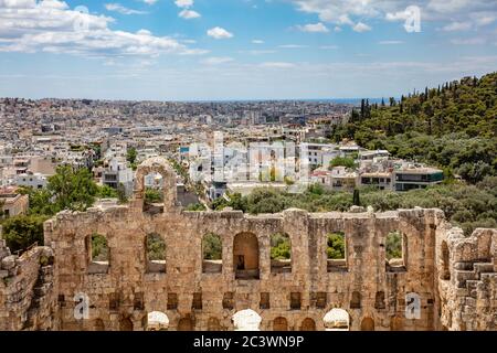 Herodes Atticus Odeon, Herodium ancient theater under the ruins of Acropolis, Greece, overlooking Athens city, sunny spring day, blue sky Stock Photo