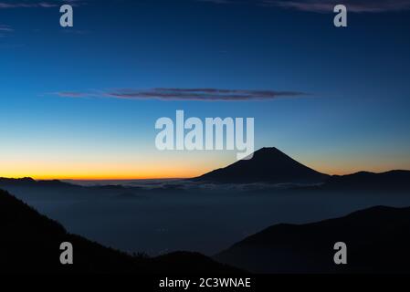 Mt. Fuji over a Sea of Clouds at Dawn Stock Photo