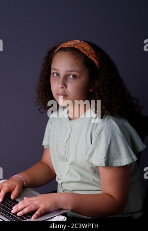 Tired girl working on a laptop Stock Photo