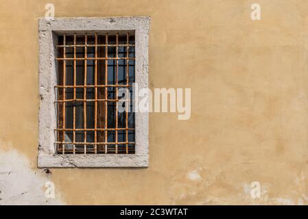 Old concrete window with rusty metal bars malcesine  italy. Stock Photo