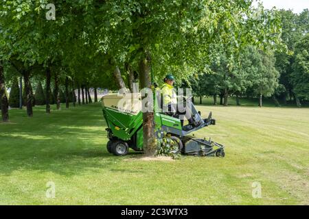 Glasgow, Scotland, UK. 22nd June, 2020. A gardener mowing the grass in Glasgow Green. The Scottish Government announced on 18th June a further easing of the coronavirus lockdown rules with the start of phase two of a four part transition out of lockdown. Credit: Skully/Alamy Live News Stock Photo
