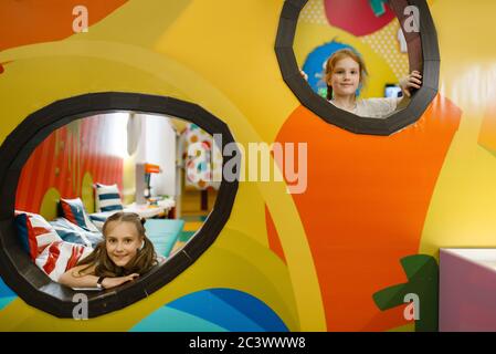 Two schoolgirls play in the entertainment center Stock Photo