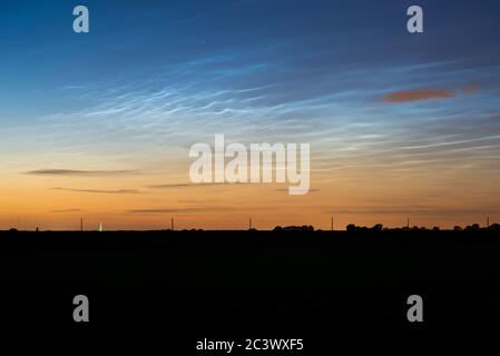 Noctilucent clouds (NLC) or night shining clouds with waves and ripples in the night sky Stock Photo