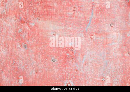 Old rusted pink painted metallic sheet Stock Photo