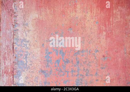 Old rusted pink painted metallic sheet Stock Photo