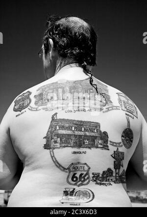 Man covered in Route 66 Tattoos, Afton Gas Station Museum & Visitor Center, Oklahoma, USA Stock Photo