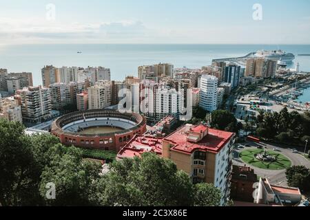 Malaga / Spain - October 2019: Landscape city view. Popular touristic destination. Overlooking the whole town: bull ring, harbour with cruise ships Stock Photo