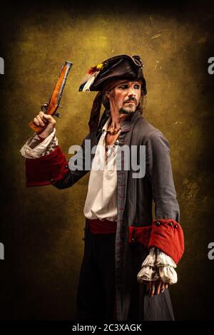 Portrait of a pirate, holding a musket gun in his hand Stock Photo