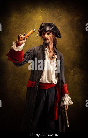 Portrait of a pirate, holding a musket gun in his hand Stock Photo