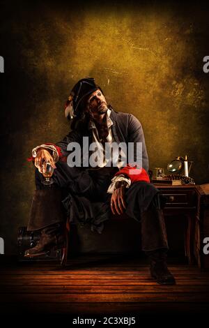 Portrait of a pirate drinking rum, sitting in a tavern Stock Photo - Alamy