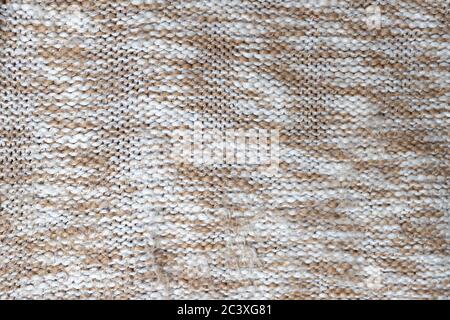 Pullover knitwear fabric print. Knitted seamless pattern. Knitted background, close-up Stock Photo