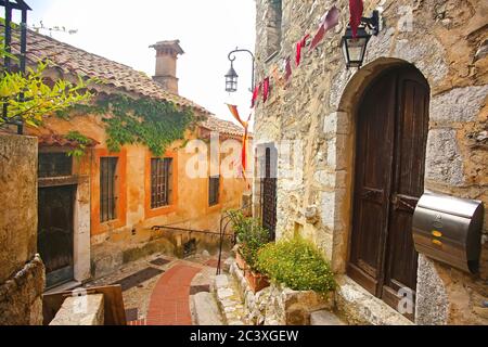 Inside the old streets of the beautiful hilltop medieval village of Eze. Historic buildings with atmosphere, French Riviera, south of France. Stock Photo