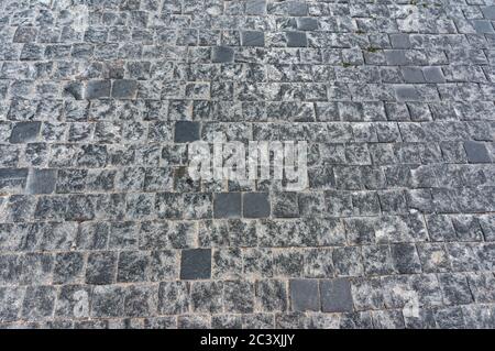 Granite cobblestoned pavement background Stock Photo