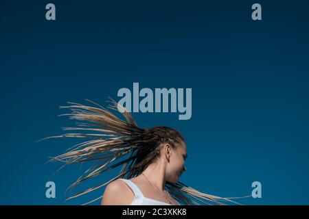 Beautiful woman waving hair with stylish afro braids Stock Photo