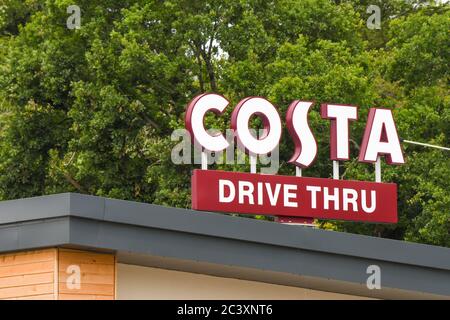 Talbot Green, Wales - June 2020: Sign on top of a Costa Coffee shop with a drive through facility. Costa is now owned by the Coca Cola company Stock Photo