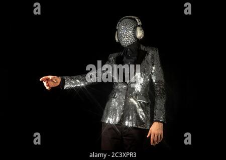 Mr disco ball wearing silver jacket dancing Stock Photo