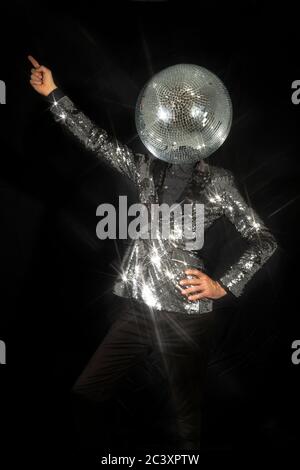 Mr disco ball wearing silver jacket dancing Stock Photo