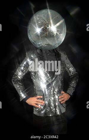 Mr disco ball wearing silver jacket dancing Stock Photo