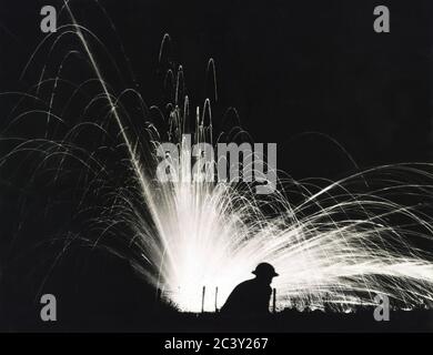 Silhouette of Soldier against Phosphorous Streamers from Bombs Exploding during Night Attack, Gondrecourt-le-Château, France, Sgt. J.J. Marshall, U.S. Army Signal Corps, August 15, 1918 Stock Photo