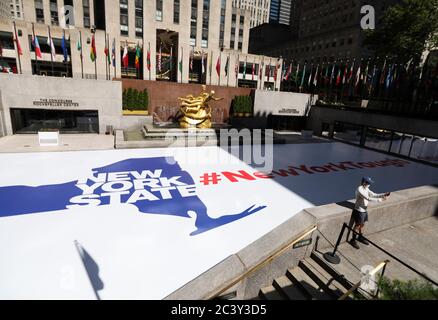 New York, USA. 22nd June, 2020. A man takes a selfie at Rockefeller Center in New York, the United States, on June 22, 2020. U.S. COVID-19 deaths surpassed 120,000 on Monday with nearly 2.3 million infections, while new cases continue to increase across the country over three months into the pandemic. Credit: Wang Ying/Xinhua/Alamy Live News Stock Photo