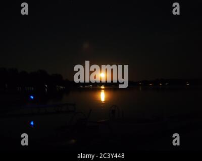 Moon Rising Over Lake Lansing Stock Photo