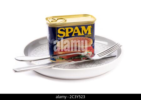 Toronto, Canada, May 10, 2020; a can of Spam luncheon meat set out with a knife and fork suggesting a minimalist dining experience isolated on white Stock Photo