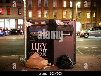 Overflowing garbage cans in Boston Stock Photo