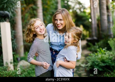 Portrait of mother with daughters (8-9, 12-13) Stock Photo